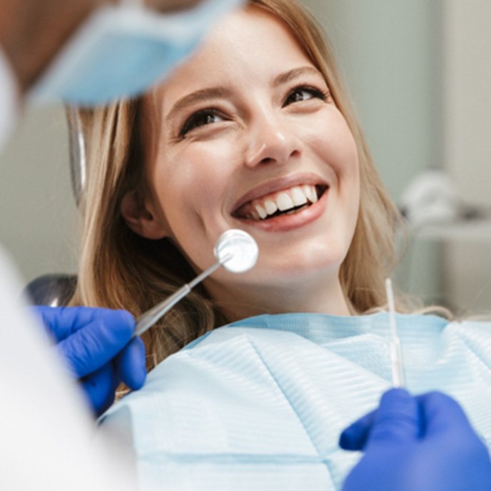 Patient smiling during a dental checkup in St. Johns