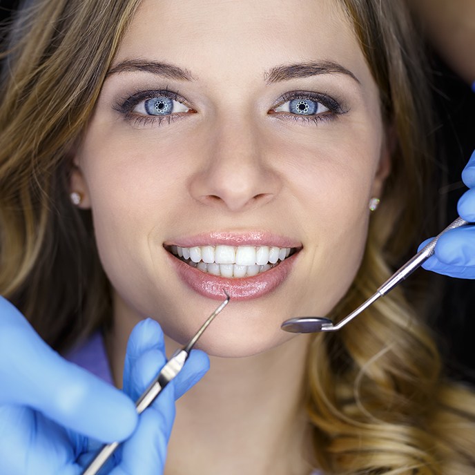 Woman receiving preventive dentistry checkup