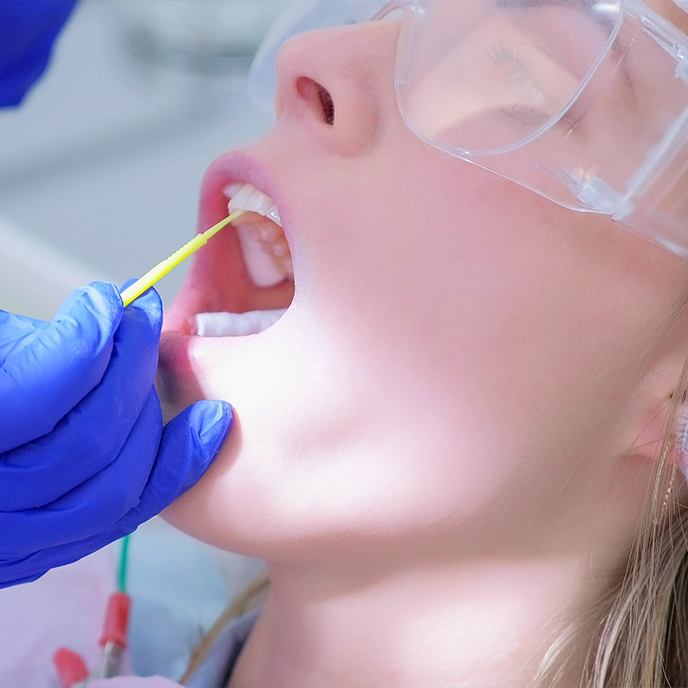 Person receiving fluoride treatment