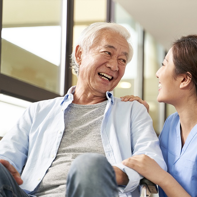 Man smiling during oral cancer screening