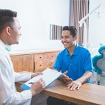 patient discussing finances with dentist 