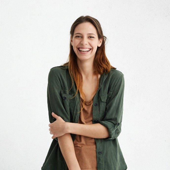 woman smiling after getting a dental bridge in St. Johns