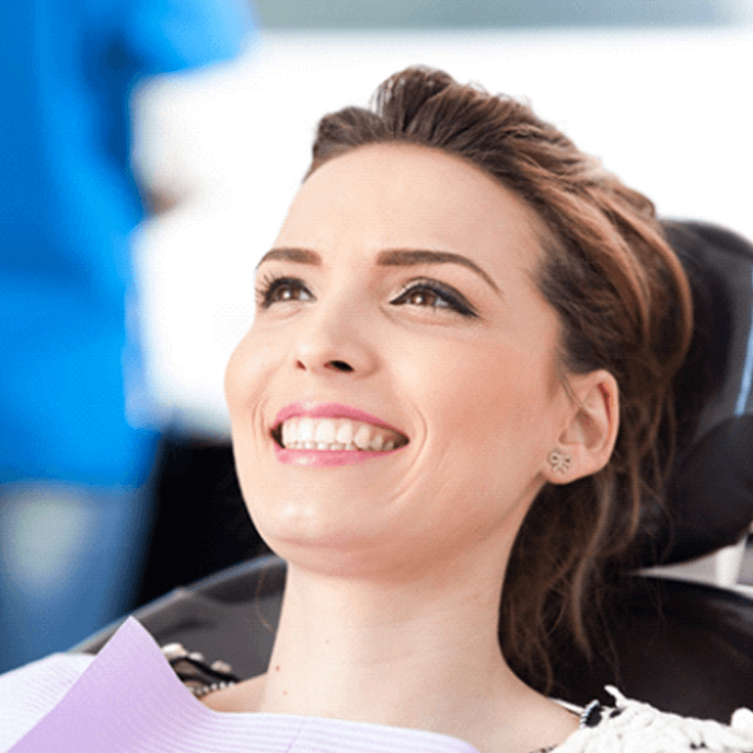 woman smiling after getting dental bridge in St. Johns