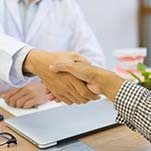 Patient and emergency dentist in St Johns, FL shaking hands