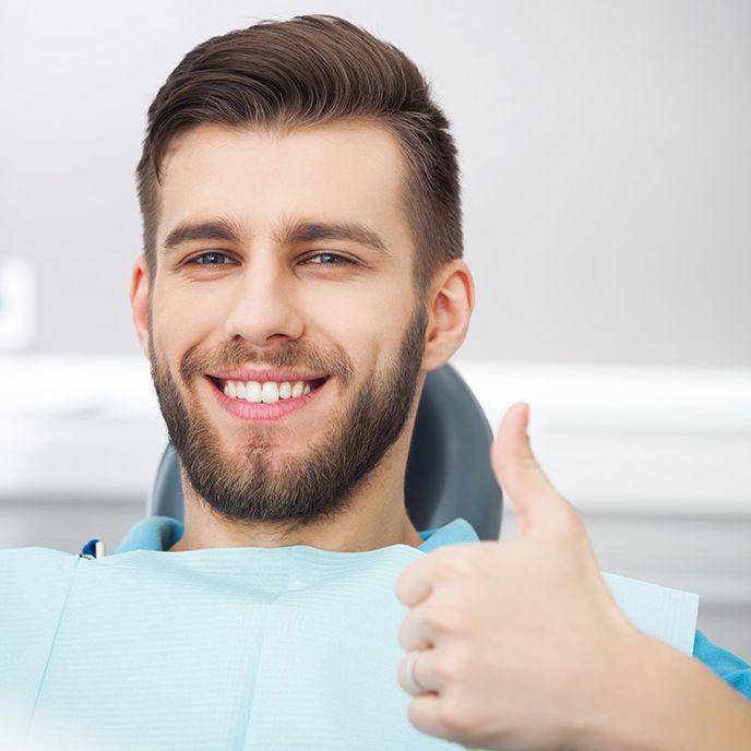 Male patient giving thumbs up