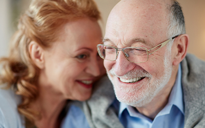 Senior man and woman laughing together