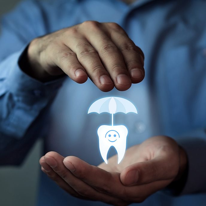 Hands holding animated tooth and umbrella