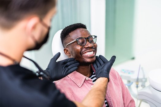 Man smiling at the dentist