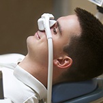 Man relaxing with nitrous oxide dental sedation in St. Johns