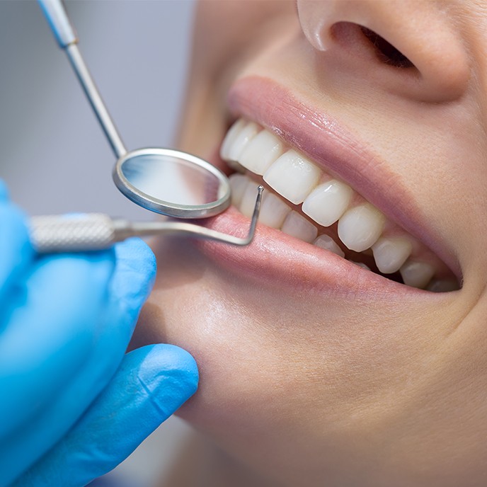 Patient receiving scaling and root planing periodontal therapy