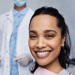 patient smiling after getting her gums treated