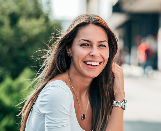 Woman sharing beautiful smile after restorative dentistry