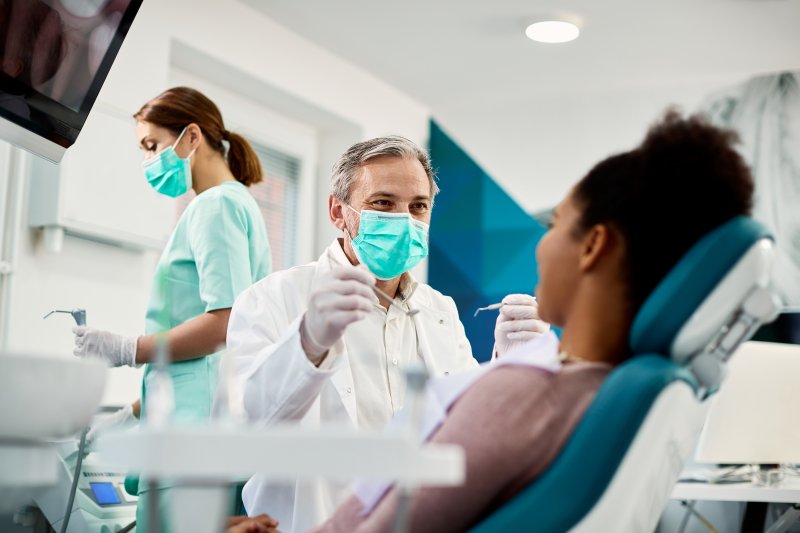 A dentist explaining the importance of routine dental checkups