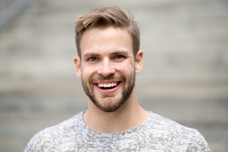 man smiling after cosmetic dentistry