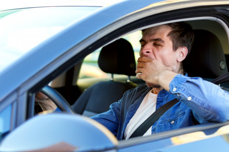 Man is sleepy in car